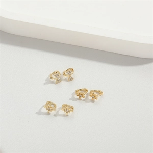 Exquisite gold mini hoop earrings set with zirconia star, flower, and bow designs