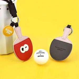 Creative table tennis paddle keychain in red and gray PU leather with a yellow background