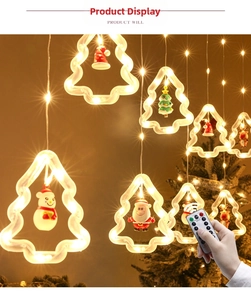 Close-up of LED Christmas window curtain lights with Santa, reindeer and snowman pendants