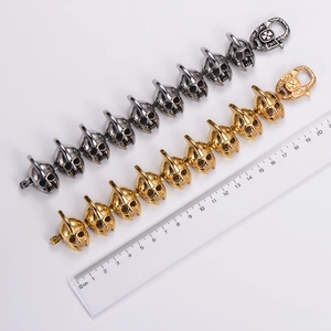 Retro punk skull head stainless steel bracelet for men in gold and antique silver finishes