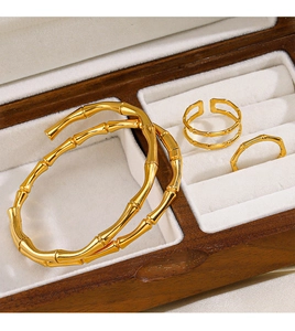 Bamboo style 18K gold plated jewelry set with bangles and rings in a wooden box