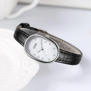 Elegant vintage oval watch with mother-of-pearl dial and black crocodile leather strap
