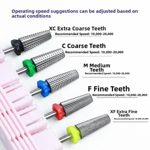 Macro view of five 5-in-1 tungsten nail drill bits with XC to XF grit labels