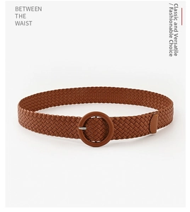 Detailed view of brown braided PU leather belt with round buckle and vintage texture