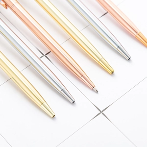 Elegant metal ballpoint pens in gold, silver, and rose gold on white tile background