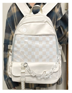 Detail view of large transparent PVC display pocket with checkerboard pattern on bag