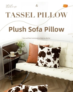 Macro detail of plush cow print and brown leather decorative throw pillows on sofa
