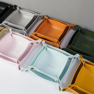 Nordic leather desktop storage trays in multiple colors with snap buttons and gold logo