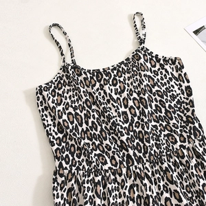 Detailed view of the leopard print fabric texture and stitching on the backless jumpsuit
