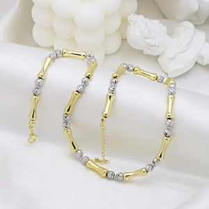 Collana di lusso bicolore a forma di bambù con perline oro e argento su seta bianca