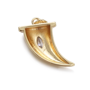 Macro view of a gold-plated horn pendant featuring a sparkling inlaid zircon stone