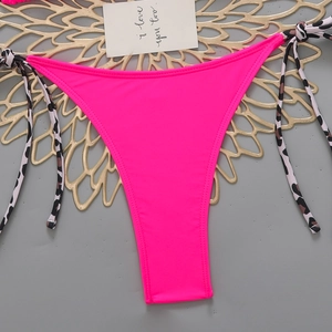 Detailed view of hot pink bikini bottoms with adjustable leopard print side tie straps
