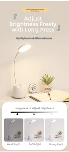 White LED desk lamp with flexible neck, phone holder and dimming function detail