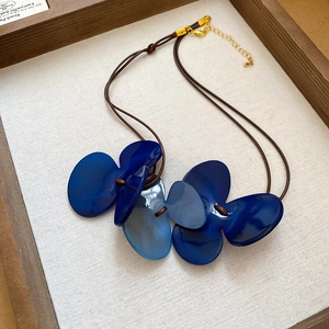 Blue petal pendant necklace with brown cord, elegant vintage style beach jewelry