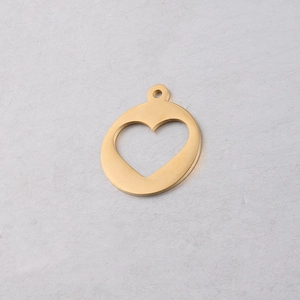 Close-up of golden stainless steel hollow heart pendant for DIY jewelry making