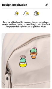 Detail of cartoon enamel cactus pins attached to a beige canvas bag showing floral pots