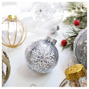 Detail of champagne Christmas ornaments with glitters and snowflakes for tree decoration