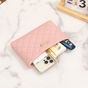 Pink quilted crossbody bag with gold hardware showing large capacity for phone and makeup