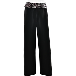Detail of high-waist straight leg trousers featuring a zebra print patterned waistband