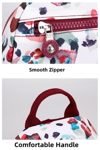 Close-up of smooth zipper and comfortable top handle on floral nylon backpack