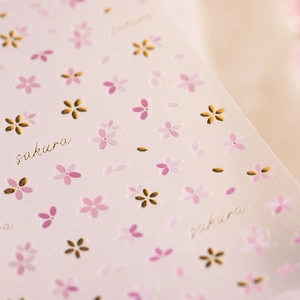 Embossed cherry blossom nail stickers with gold stamping and sakura floral designs