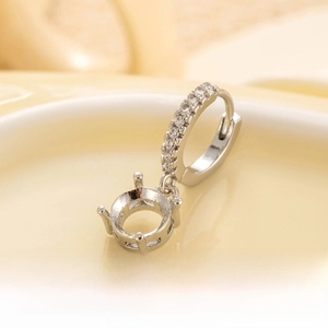 Silver DIY earring accessory with zircon studs and a four-prong stone setting