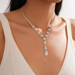 Detailed view of silver-tone teardrop pendant necklace with sparkling rhinestones