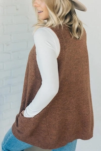 Detail of brown V-neck knit vest texture with side pocket on a female model