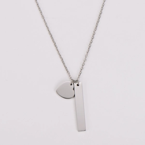 Detailed view of silver stainless steel necklace with heart and rectangular bar pendants