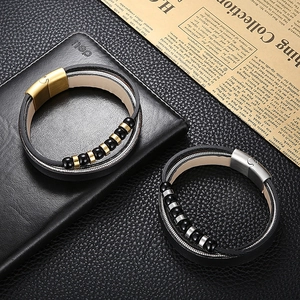 Close-up of double-layer men's leather bracelet with steel chain and magnetic buckle