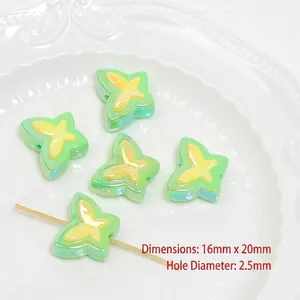 Macro detail of 16x20mm UV coated acrylic bow beads with 2.5mm hole for DIY crafts
