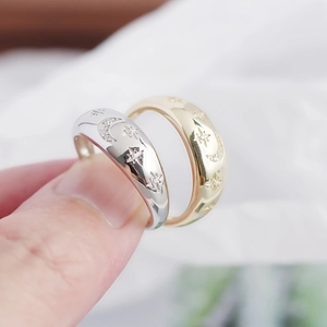 Close-up of gold and silver S925 rings featuring celestial star and moon zircon engravings