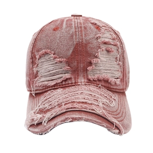Distressed wash baseball cap in rust red with ripped holes and frayed edges for unisex