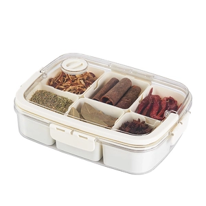 A 45-degree view of a 6-compartment clear kitchen spice box set with an ivory lid