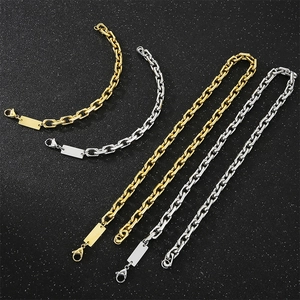 Detail of stainless steel curb chains in gold and silver with lobster clasps and tags