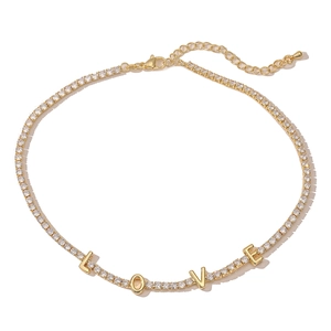 18K gold-plated necklace with LOVE pendants and sparkling zircon stones on white background