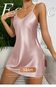 Detailed close-up of pink satin nightgown with side slit and smooth fabric texture