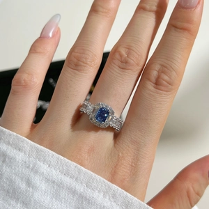 Close-up of S925 silver ring featuring a blue heart gemstone and pave-set zircons