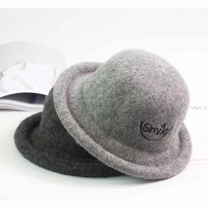 Detail of wool blend kids cloche hats in grey with Smile embroidery and rolled brims