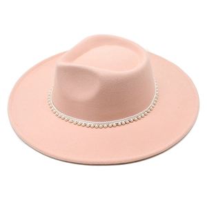 Detailed view of pink wool fedora hat featuring elegant pearl embellishment on the band