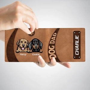 Close-up of brown leather bifold wallet featuring custom cartoon dog prints and names