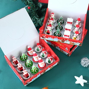 Top view of 12-piece Christmas tea light candle set with Santa, tree, and snowman shapes