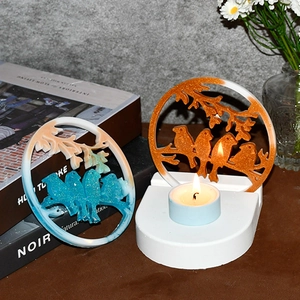 Bird and branch resin candle holder mold on a round base with blue teal glitter finish