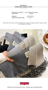 Detail of double-sided cashmere-like scarf showing 68x200cm size and tassel design