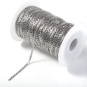 Macro shot of a roll of silver-colored stainless steel Cuban link chain for DIY jewelry