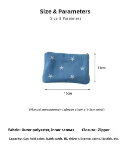 Detail view of denim star print pouch with zipper showing 16x11cm dimensions