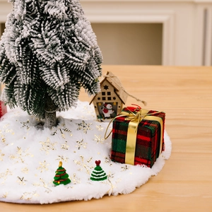 White faux fur Christmas tree skirt with gold sequin snowflakes for festive home decor