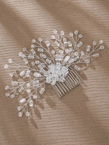 Detailed macro view of handmade bridal hair comb with silver wire and clear crystal beads