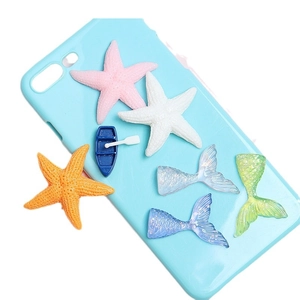 DIY ocean-themed resin starfish and mermaid tail charms on light blue phone case