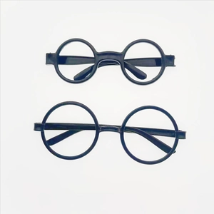 Detailed view of two pairs of black circular plastic spectacle frames for party costumes